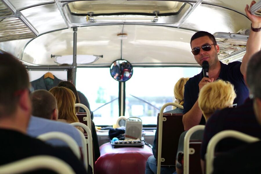 Warsaw: Highlights Guided Retro Bus Tour - Palace of Culture and Science again: the controversial landmark explained