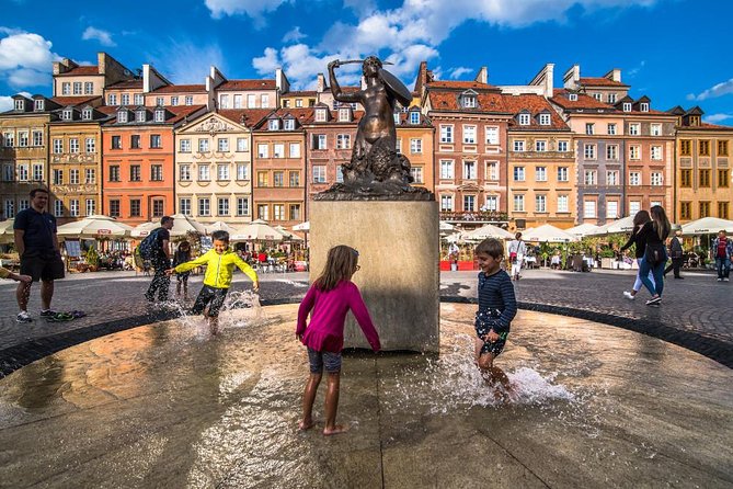 Warsaw Layover City Tour by car with airport pick-up - Old Town by car: Sigismund, Royal Castle views, and the Barbican
